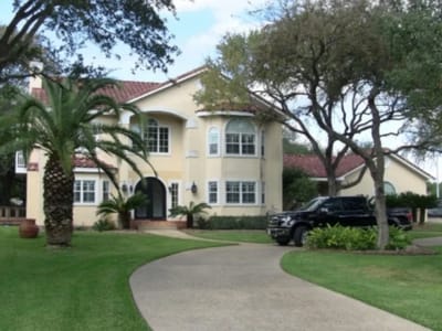 Exterior view of Garden Ridge Senior Living with landscape