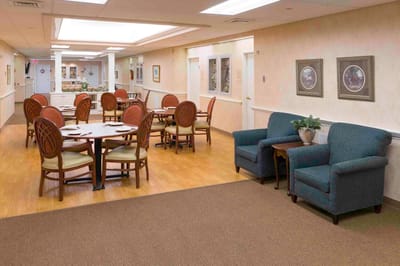 Bright common area with dining tables and seating