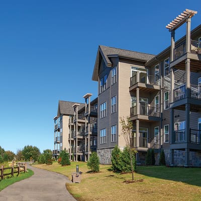 Exterior view of Fairway Knoll with landscaped path