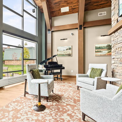 Bright common area with a piano and seating