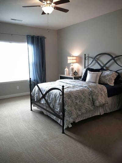 Cozy private resident room with a bed and decor