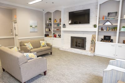 Cozy common area with seating and a fireplace