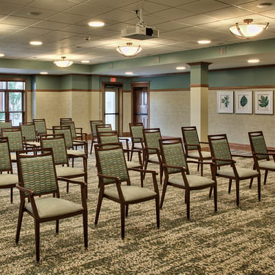 Empty activity room with arranged chairs