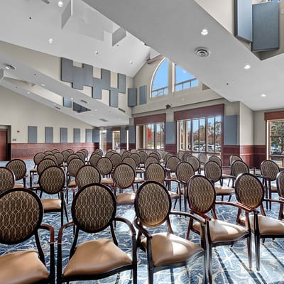 Interior view of a large room with empty chairs