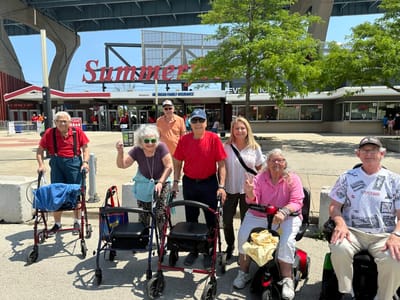 Residents enjoying an outing in front of a building