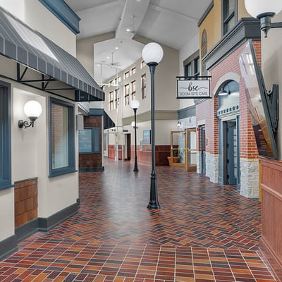 Interior hallway of a senior living facility with café sign