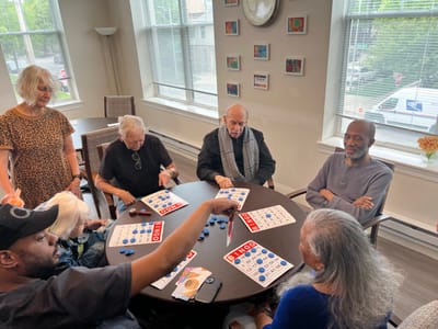 Residents enjoying a bingo game in a common area