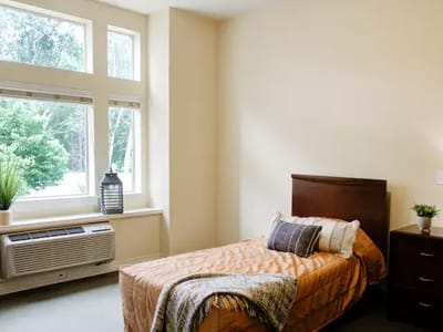 Cozy private room with bed and window view