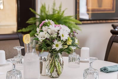 Table setting with flowers in the dining area