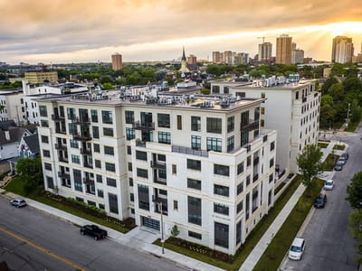 Aerial view of Wilson Commons building with city skyline