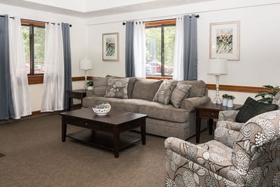 Cozy lounge area with a sofa and chairs