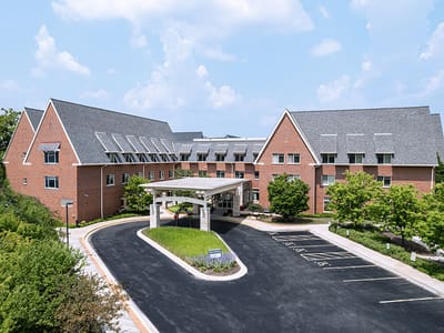 Exterior view of Wilson Commons building with landscaped entrance