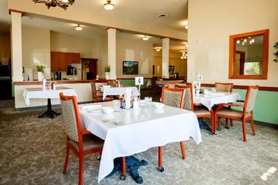 Dining room setup with tables and chairs