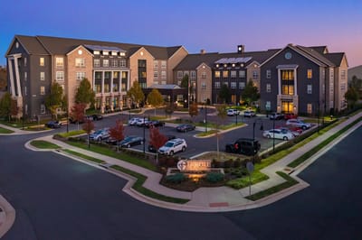 Aerial view of the facility exterior during twilight