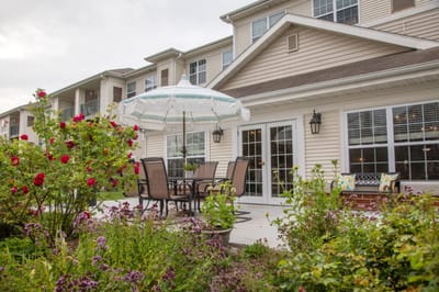 Outdoor patio area with seating and flowers