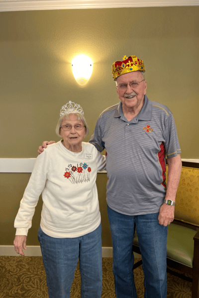 Residents celebrating wearing crowns in a common area