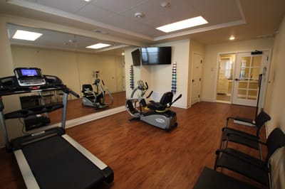 A fitness room with exercise equipment