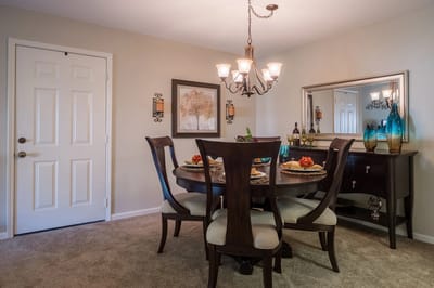 Well-decorated dining room with table and chairs