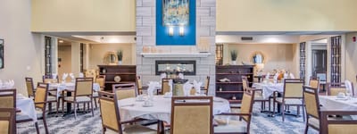 Dining room with elegantly set tables and decor
