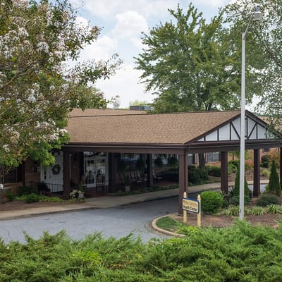 Building entrance of White Oak Manor Charlotte with landscaping