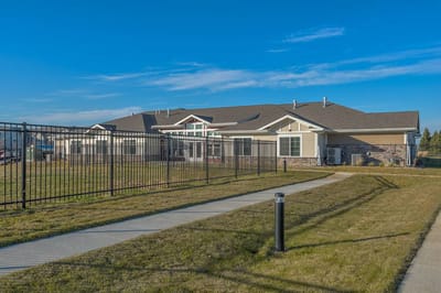 Exterior view of Northridge Village building with garden