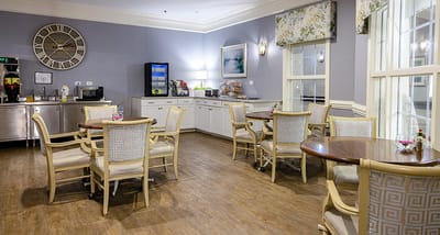 Cozy dining area with tables and chairs