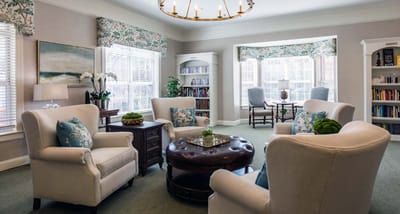 Cozy common area with seating and bookshelves