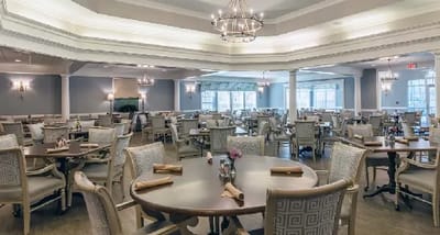 Elegant dining room setup with tables and chairs