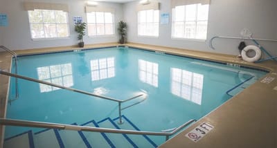 Indoor swimming pool with clear water and natural light