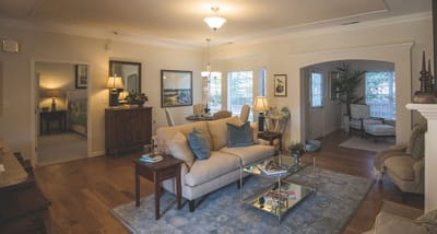 Warm interior lounge area with seating and decor