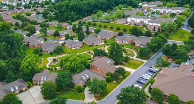 Aerial view of a senior living campus with gardens