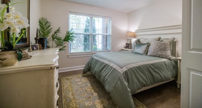 Cozy private room with a bed and decorative elements
