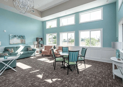 Bright common area with comfortable seating and large windows