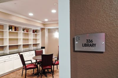Interior view of library with a sign and seating area