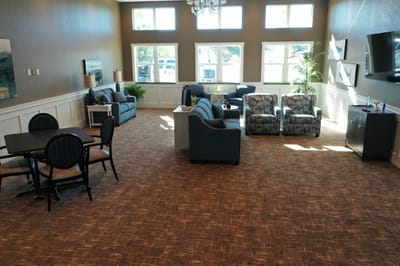 Bright common area with seating and tables