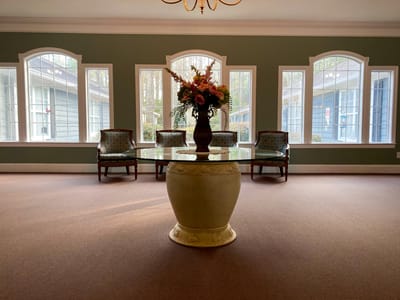 Bright common area with seating and floral decoration