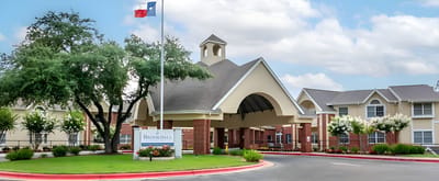 Exterior view of the facility with entrance and landscaping