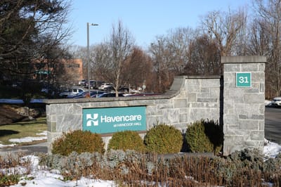 Entrance sign for Hancock Hall facility