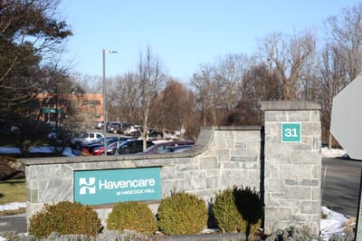 Entrance sign for Hancock Hall facility