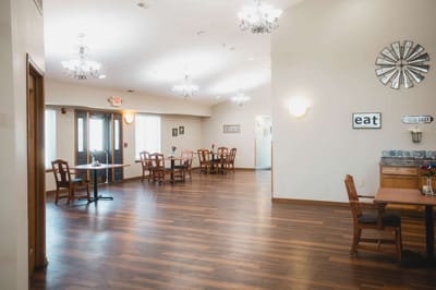 Spacious dining area with wooden tables and chairs