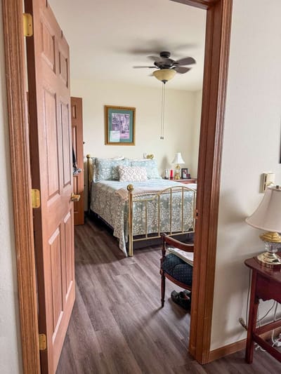 Interior view of a private resident room with a bed
