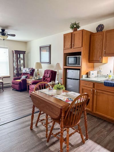 Cozy interior of a resident's room with seating area