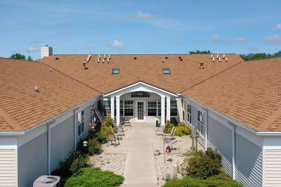 Aerial view of the facility exterior with pathways and garden
