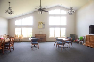 Bright common area with tables and chairs
