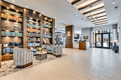 Interior shot of a welcoming lobby with bookshelves