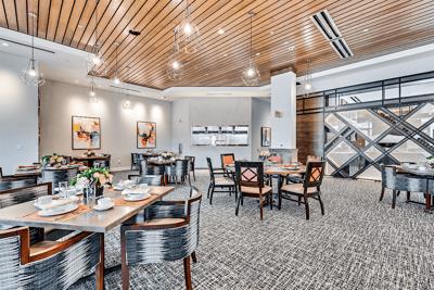 Bright dining room with elegantly set tables
