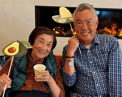 Residents having fun with props in a cozy setting