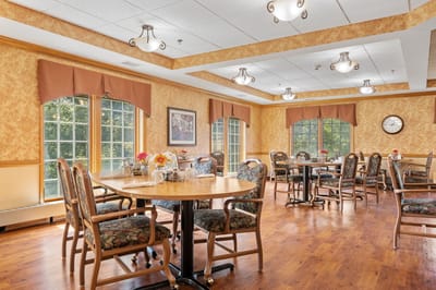 Bright dining room with tables set for meals