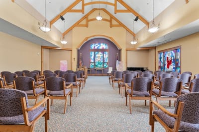 Interior view of a facility common area with chairs