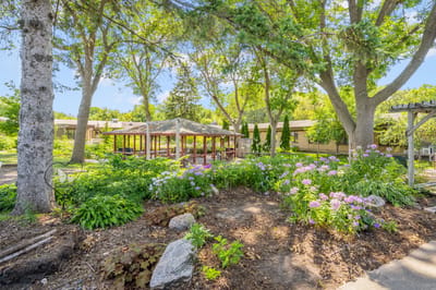 Beautifully landscaped outdoor space with flowers and seating area